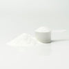 A powder cup of Pure Rebuild, a pineapple flavored muscle recovery supplement